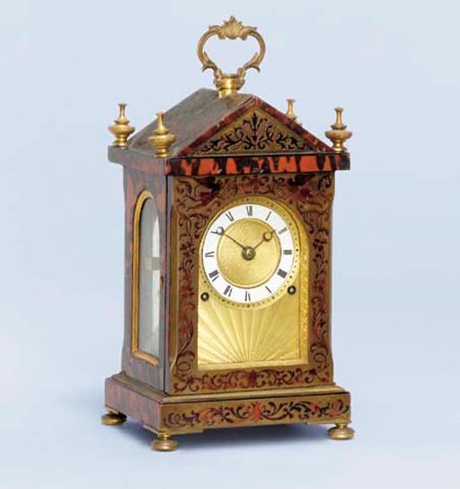 A George IV red boulle tortoiseshell and ormolu-mounted striking small mantel clock