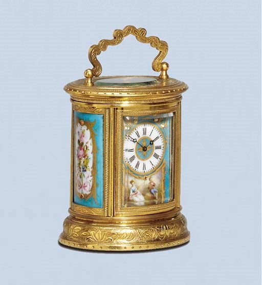 A French engraved brass and porcelain-mounted miniature carriage timepiece