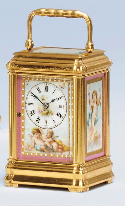 A French gilt-brass and porcelain-mounted small striking carriage clock