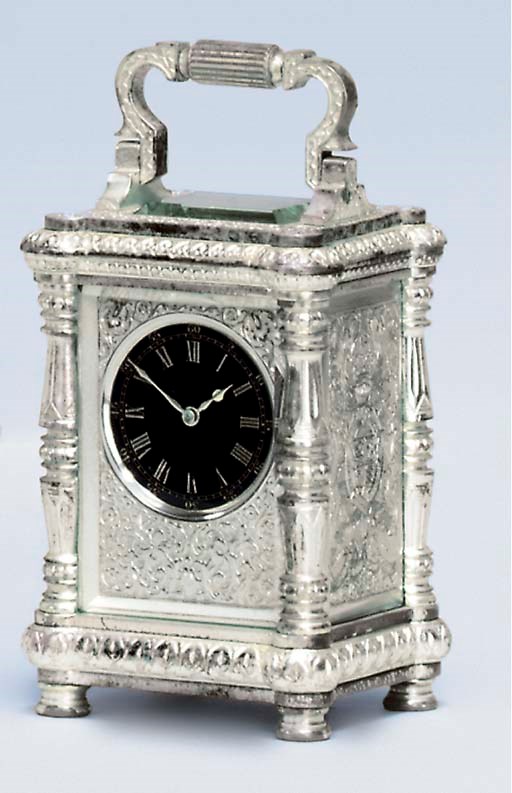 A French silvered and engraved brass miniature travel timepiece