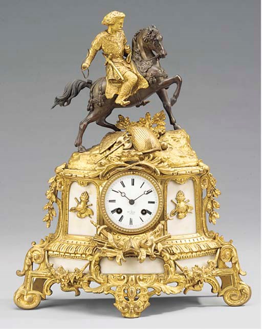 A Napoleon III gilt and patinated bronze and white marble figural striking mantel clock, circa 1860