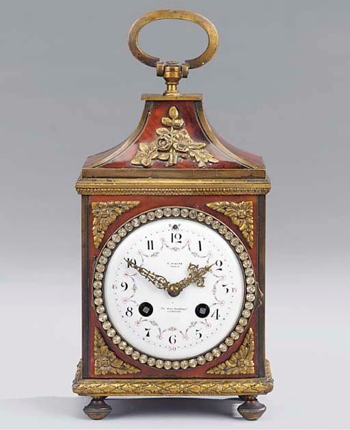 A French red-stained tortoiseshell and gilt-metal mounted pendule d'officer style mantel clock, circa 1900