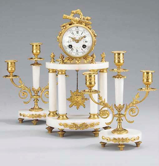A French white marble and gilt-metal striking portico mantel clock and garniture, circa 1910