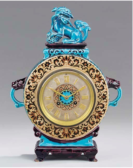 A French glazed pottery striking mantel clock, circa 1880