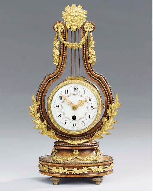 A French gilt-metal mounted burr-walnut miniature lyre timepiece, circa 1900