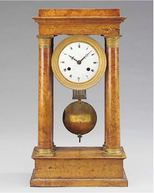 A Charles X ormolu-mounted burr-walnut striking portico mantel clock, circa 1825