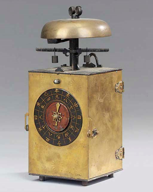 A Japanese brass and iron striking lantern clock (kake-dokei), 19th century