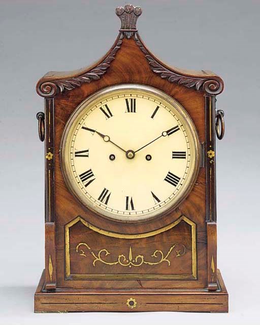 A Victorian mahogany and brass inlaid striking table clock, circa 1840