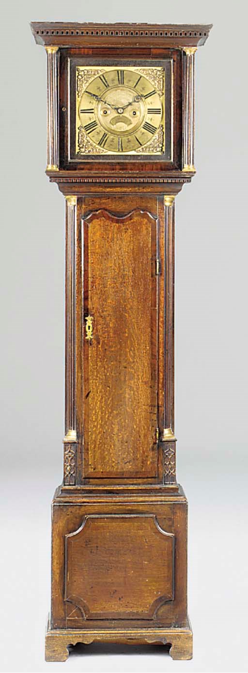 An English oak and mahogany longcase clock
