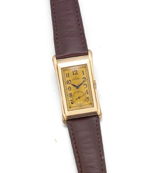 ROLEX: A 14ct. GOLD AND STEEL RECTANGULAR WRISTWATCH
signed Rolex, Prince Elegant, Ref: 2771, circa 1935.