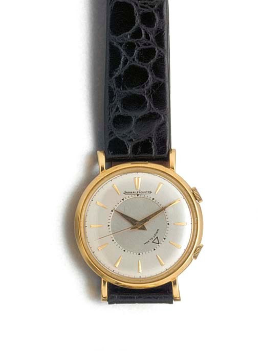 JAEGER-LECOULTRE: AN 18ct. GOLD CENTRE SECONDS WRISTWATCH WITH ALARM
signed Jaeger-LeCoultre, Model: Memovox, circa 1960.