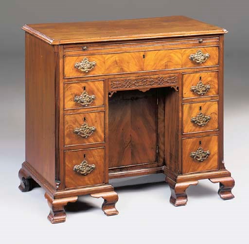 A MAHOGANY KNEEHOLE DESK
