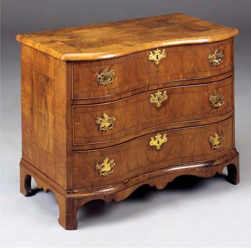 A SOUTH GERMAM WALNUT SERPENTINE COMMODE