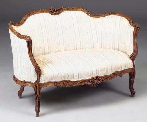 A FRENCH WALNUT AND UPHOLSTERED CANAPE