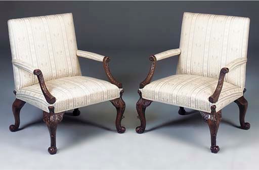 A PAIR OF LARGE MAHOGANY AND UPHOLSTERED OPEN ARMCHAIRS