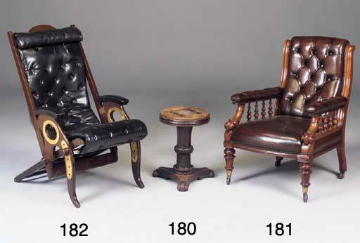 A LATE VICTORIAN WALNUT AND LEATHER UPHOLSTERED OPEN ARMCHAIR