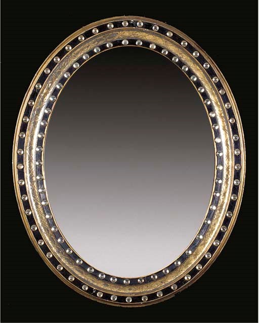 A SET OF THREE OVAL WALL MIRRORS