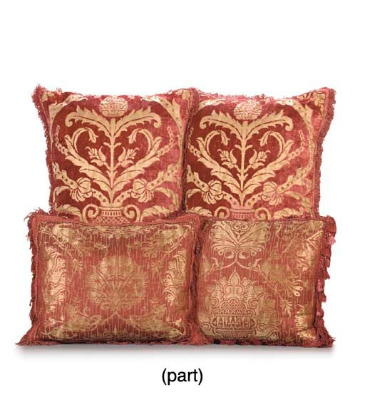 A GROUP OF SIX CRIMSON SILK AND VELVET PILLOWS,