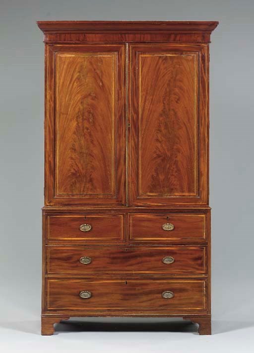 A LATE GEORGE III MAHOGANY AND LINE INLAID LINEN PRESS,