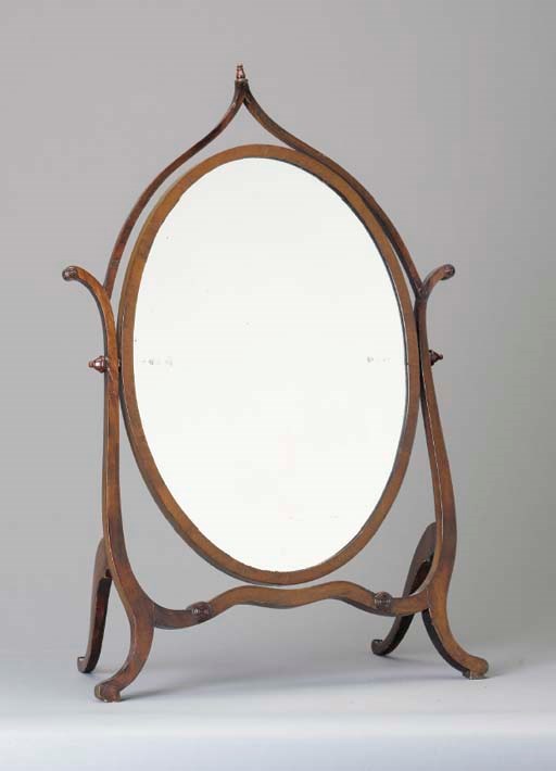 AN OVAL MAHOGANY DRESSING MIRROR,
