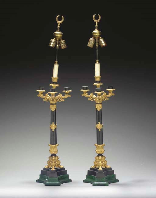 A PAIR OF RESTAURATION PATINATED-BRONZE, ORMOLU AND SIMULATED MALACHITE FOUR-LIGHT CANDELABRA,