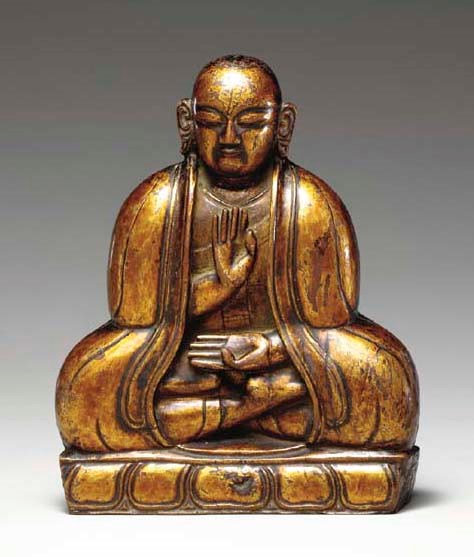 A Gilt Lacquered Wood Figure of a Lama