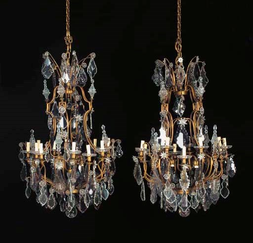 A pair of French brass, clear- and amethyst-glass twelve-light chandeliers