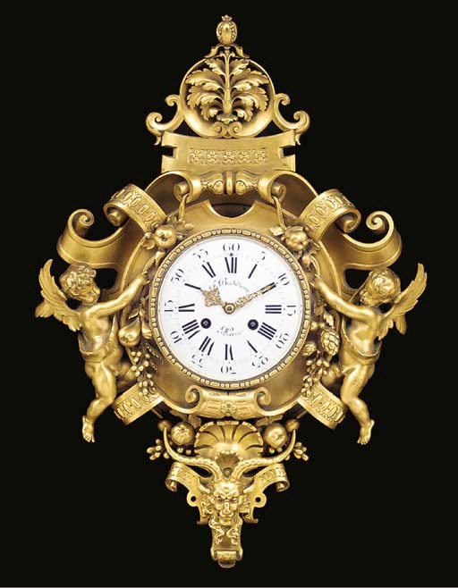A Napoleon III gilt-bronze cartel clock