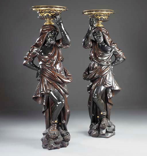 A pair of Venetian parcel-gilt patinated carved-wood blackamoors