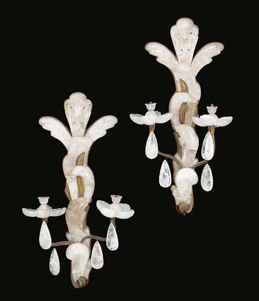 A pair of large gilt-bronze and rock crystal twin-light bras de lumieres