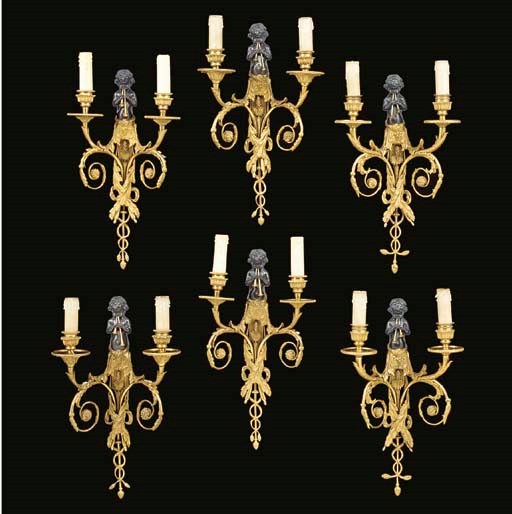 A set of six gilt- and patinated-bronze two-light bras de lumiere