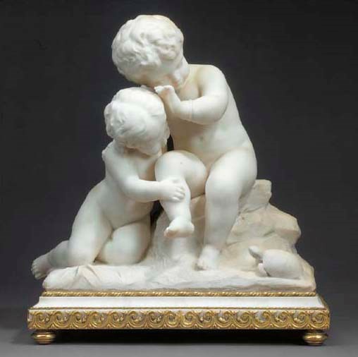 A white marble group of two playing cherubs