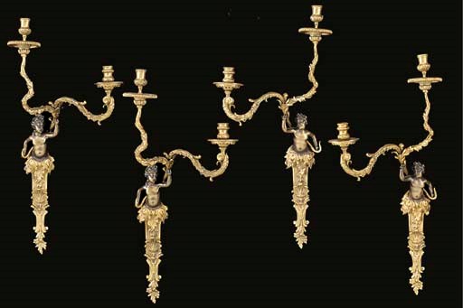 A set of four French gilt- and patinated-bronze two-light bras de lumiere
