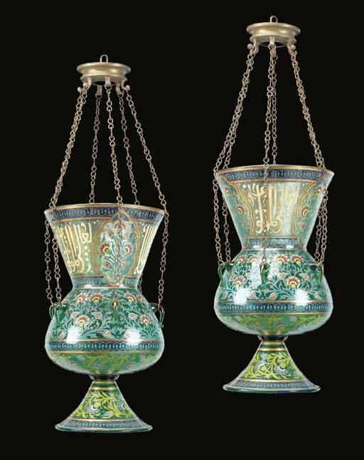 A pair of Mamluk style enamelled and gilded glass mosque lamps