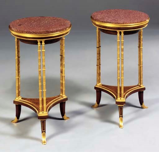 A pair of French gilt-bronze, emboyna and porphyry gueridons