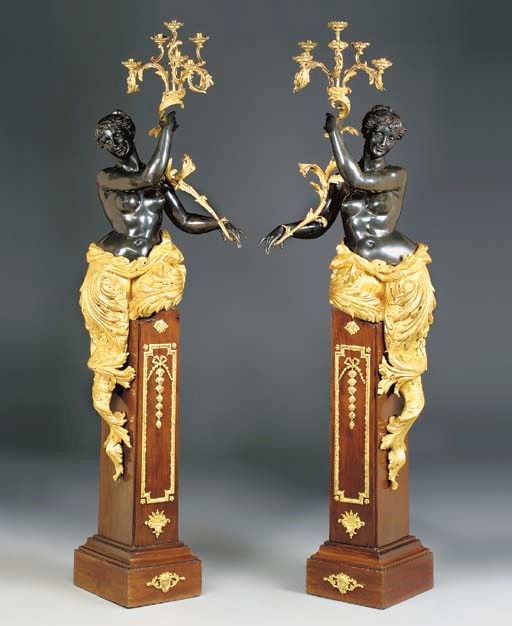 A pair of ormolu-mounted mahogany, giltwood and patinated-bronze figural six-light torcheres