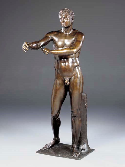 An Italian life-size patinated-bronze figure of an athlete