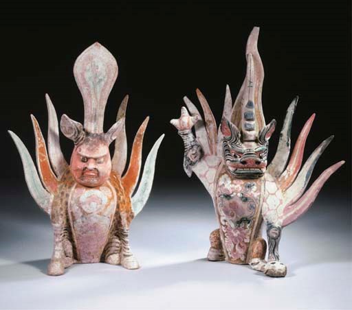 A rare pair of painted red pottery figures of earth spirits