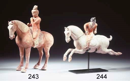 A painted red pottery figure of an equestrian figure