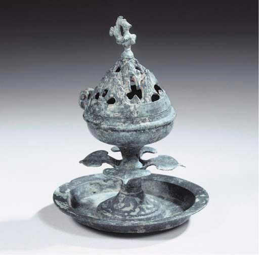 A bronze censer and hinged cover