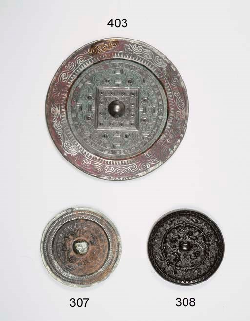 A bronze mirror, Jing, and a buckle