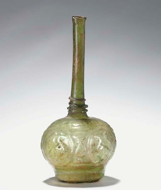 A pale green mould blown glass bottle, Iran, 12th first half 13th century