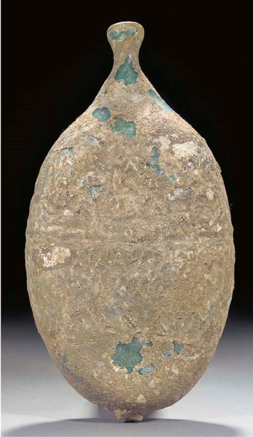 A moulded light green glass bottle, probably Egypt or Syria, 11th Century