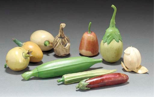 A large collection of North Indian stained ivory carved fruit, 19th century