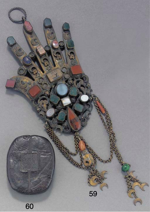 An Ottoman inset brass model of the hand of Fatima, 19th century
