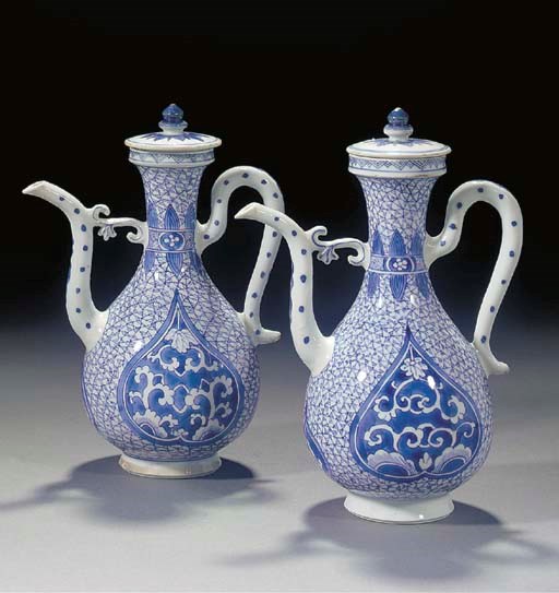 A pair of Chinese blue and white Islamic market ewers and covers, Kangxi