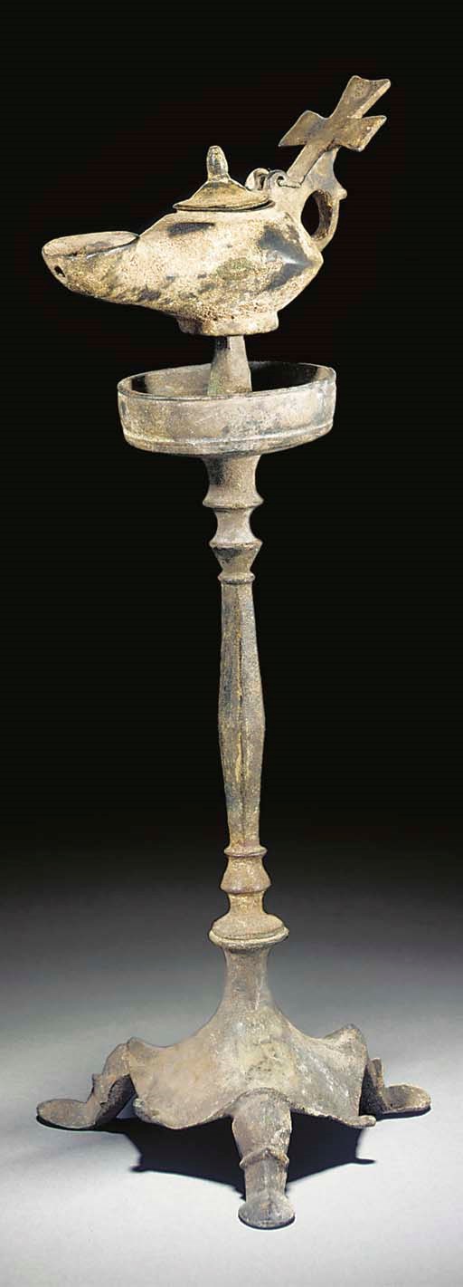 A BYZANTINE BRONZE LAMP AND STAND