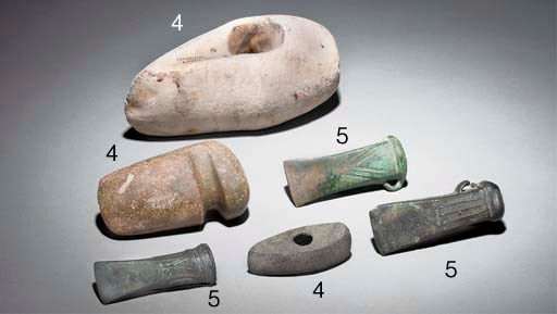 A LARGE LATE NEOLITHIC CREAM STONE AXE-HEAD