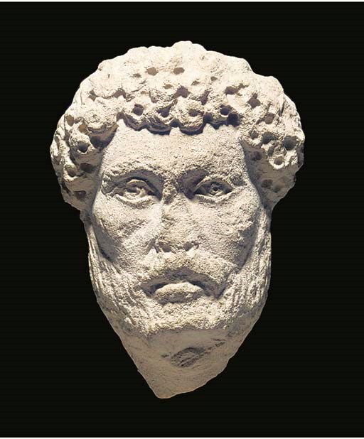 AN EAST ROMAN LIMESTONE BEARDED MALE HEAD