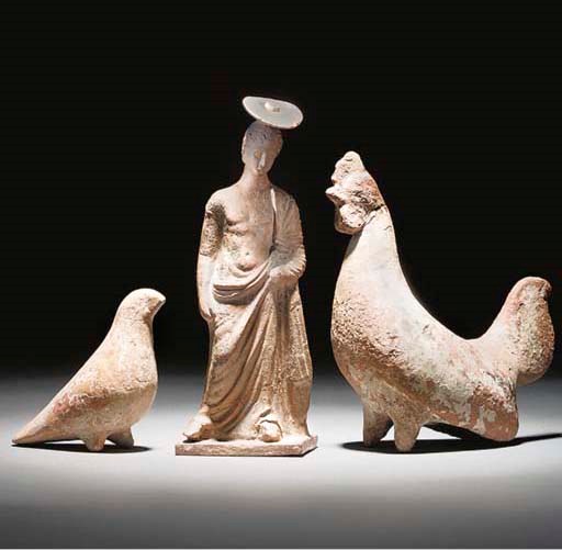 A BOEOTIAN TERRACOTTA FIGURE OF A YOUTH